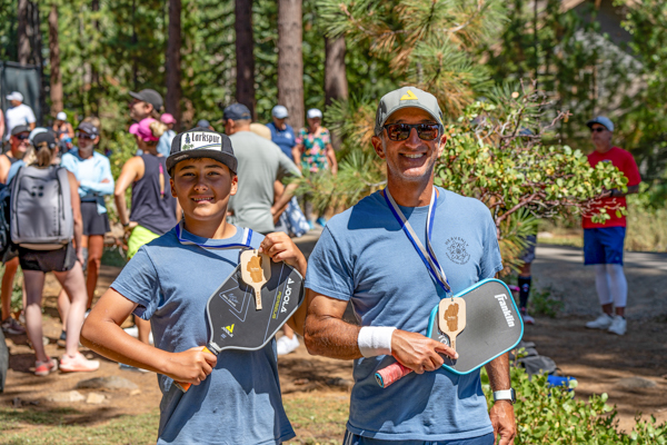 boy and dad with pickleball medals